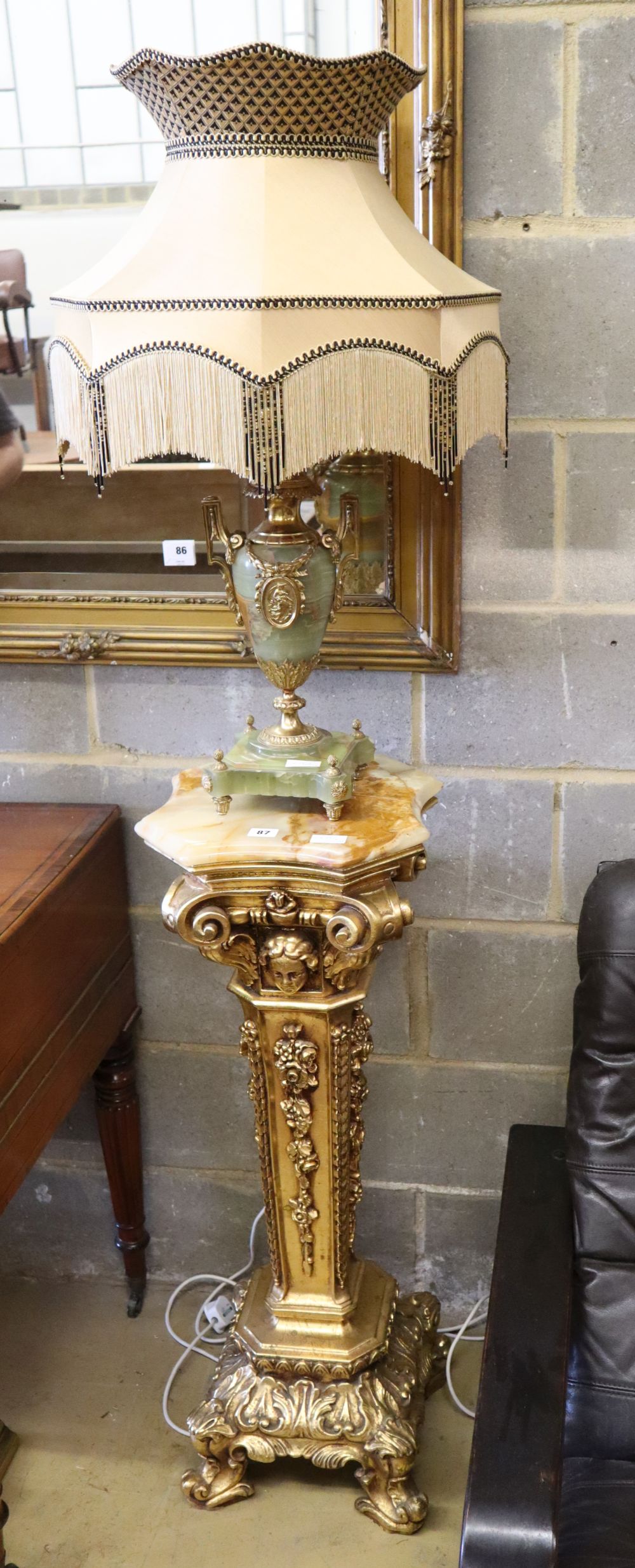 A Harrods gilt pedestal and an onyx lamp with shade, pedestal H.96cm